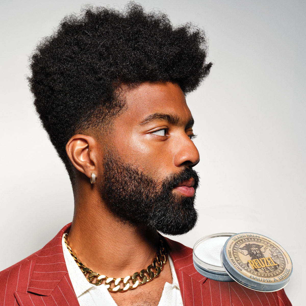Reuzel Beard Balm Wood & Spice jar with natural ingredients and woodgrain design, showcasing the beard styling product.