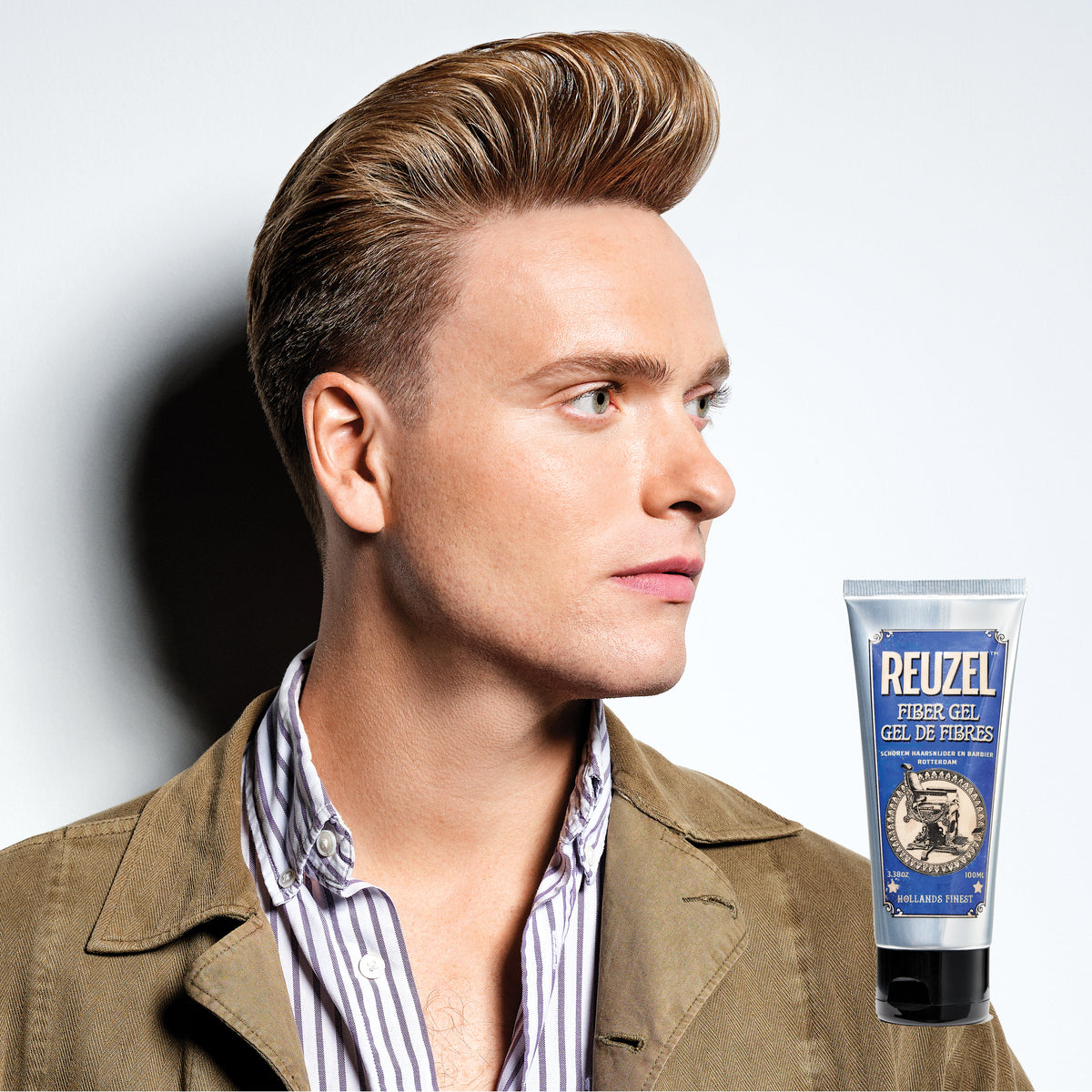 Reuzel Fiber Gel hair styling product in a container, showcasing its thickening and texturizing gel for men's hair styling.