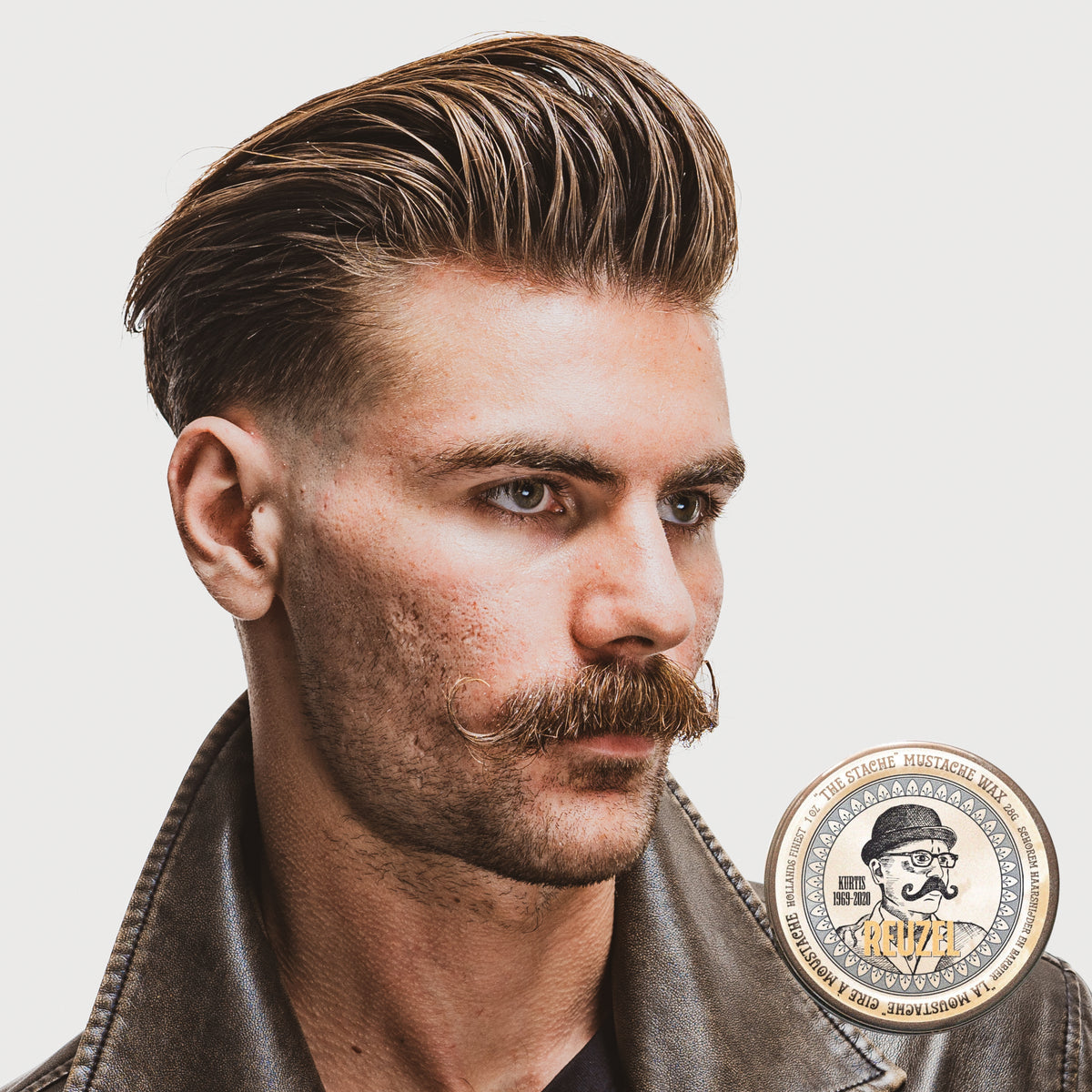Reuzel The Stache Mustache Wax in a tin, designed for shaping and conditioning mustaches with natural beard styling products.