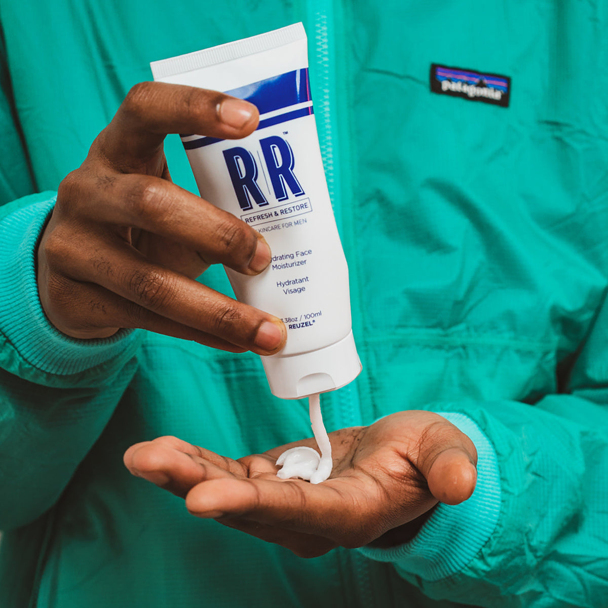 Reuzel hydrating face moisturizer in a sleek jar, showing the creamy skin care product designed for deep hydration.