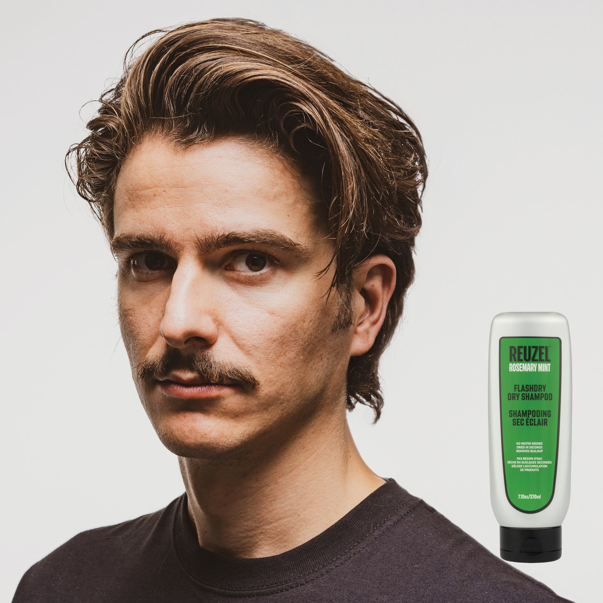 Reuzel Germany FLASHDRY Dry Shampoo in a spray bottle, designed for quick hair refreshment and oil absorption.